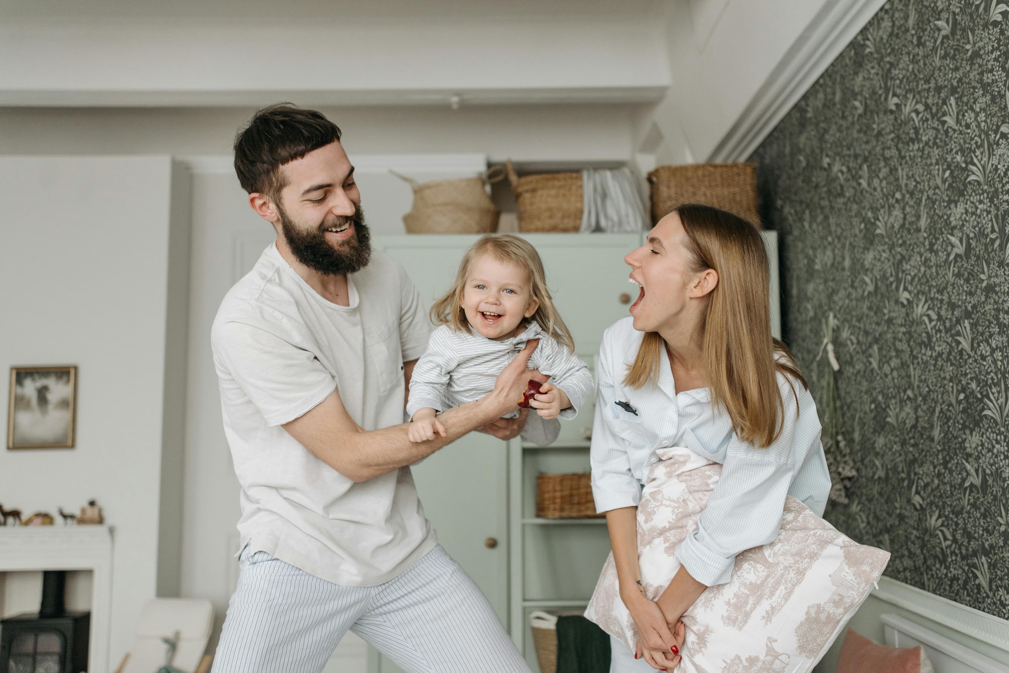 Parents smiling with their daughter